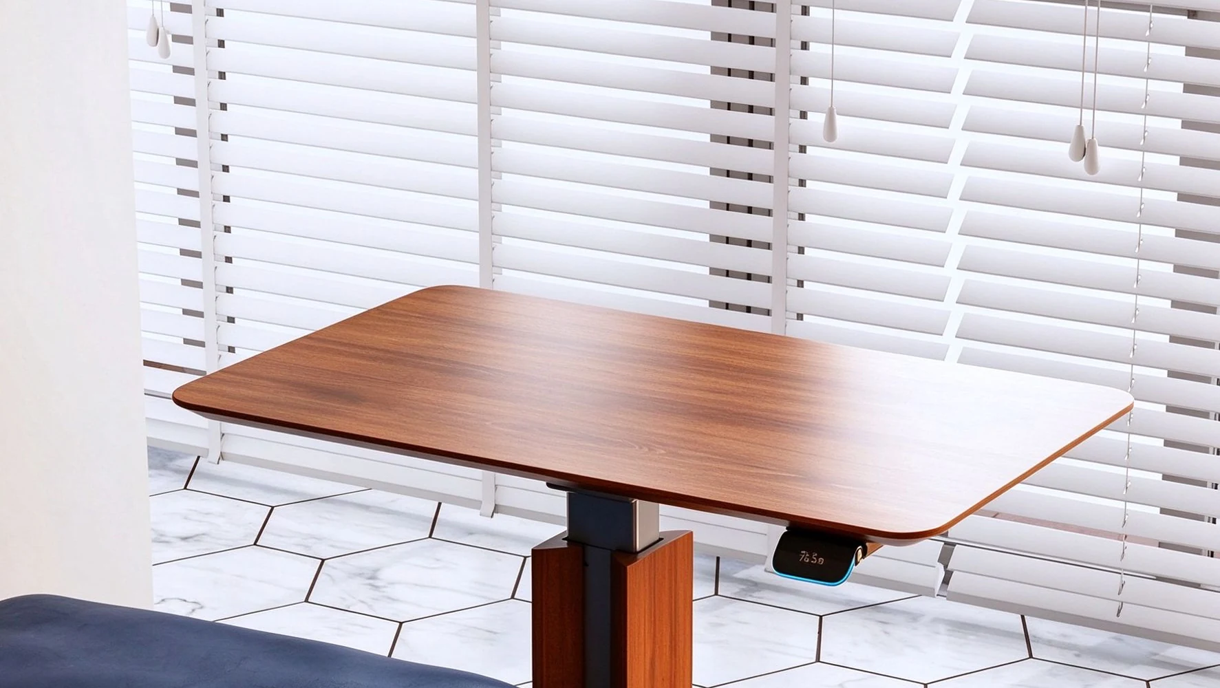 Wood-top height-adjustable side table beside an armchair